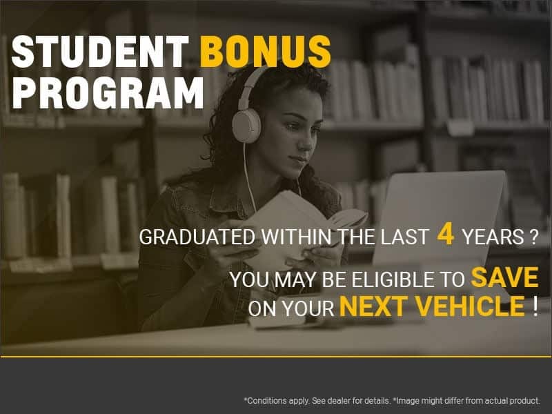 Student with headphones studying on laptop; text promotes vehicle savings for recent graduates.