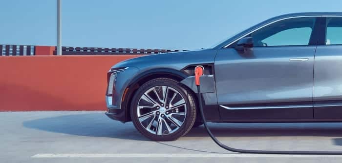 Electric car charging at a station, highlighting modern vehicle technology and sustainability.